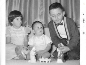 1959 Dec. Mary, John, Dave w creche.jpg